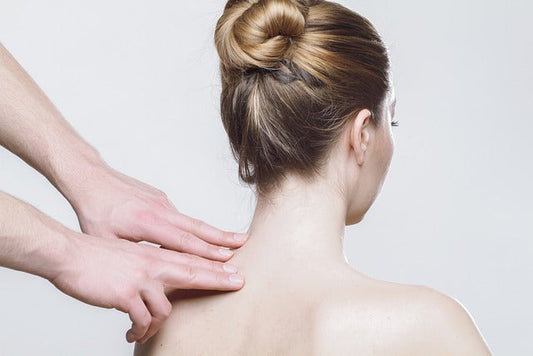 Woman getting a neck and shoulder massage.